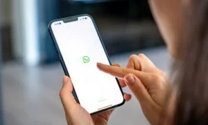WhatsApp Being Used on a Mobile Device By a Woman Holding the phone